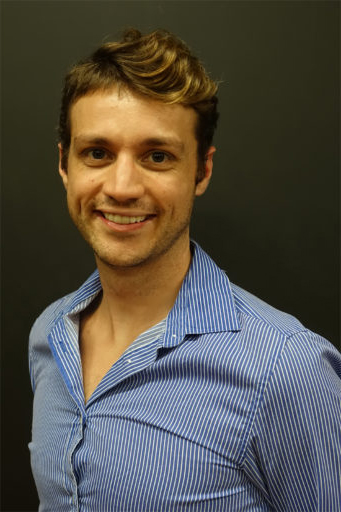 Professional headshot of Tim Brown. He has short brown hair and is smiling.
